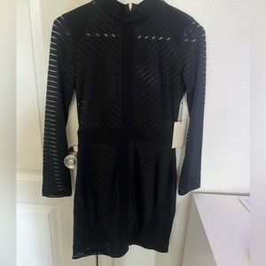 Black mini dress. See through from the top. Never worn.